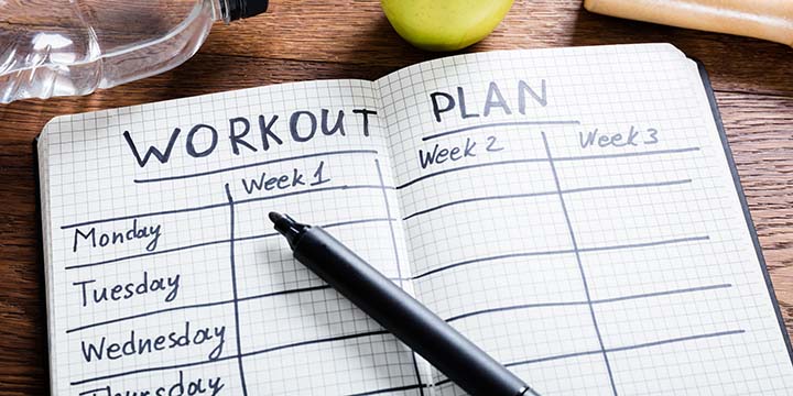 A workout journal, displaying the days of the week.