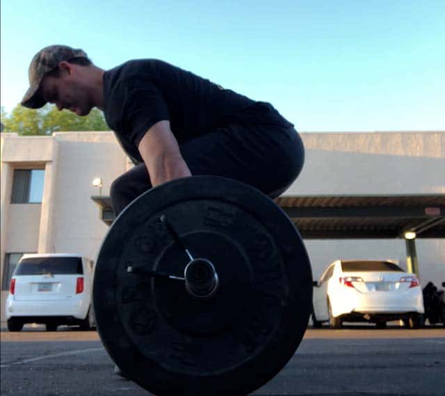 The start position for the deadlift behind the back.