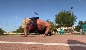 The author of Lunch Break Fitness doing weighted push-ups.